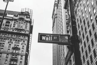 grayscale photo of 1-21 Wall street signage by Chris Li courtesy of Unsplash.