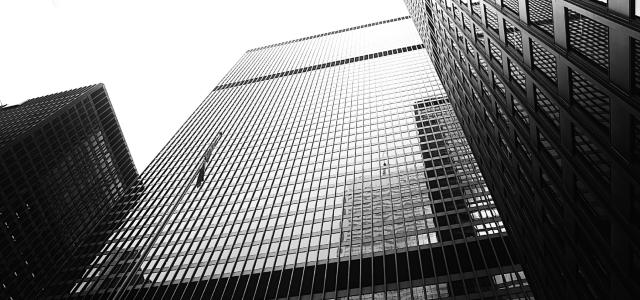 grayscale photography of high rise building by Michele Orallo courtesy of Unsplash.